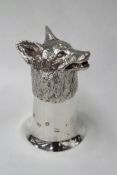 A modern silver stirrup cup moulded in the form of a fox head. London 1976. 12cm high. 10ozs.