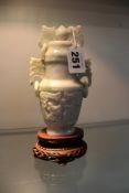 A Chinese hardstone two handled vase and cover with stand. 14cm high. (boxed).