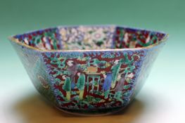 A 19th Century Japanese hexagonal porcelain bowl decorated with figures and landscape scenes. 19cm