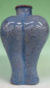 A Chinese mottled blue bulbous stoneware vase. 24cm high.