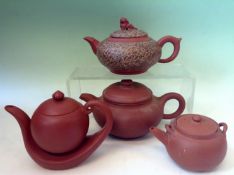 Four Chinese terracotta teapots.