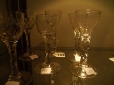 Three pairs of 19th Century cordial glasses with faceted stems. The smaller pair acid etched with