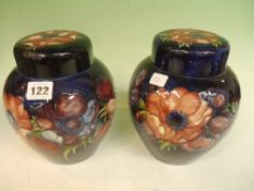 A pair of Moorcroft baluster ginger jars with covers. 20cm high.