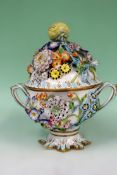 A 19th Century floral encrusted two handled pot pourri and cover, possibly by the Coalbrookdale