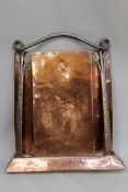 An Arts and Crafts wrought iron and copper fire screen. Scrolling leaf form surround. 68cm high.