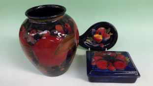 A Moorcroft pottery baluster vase. Pomegranate and berries pattern. 17cm high.