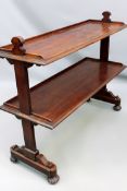 A 19th Century mahogany two tier buffet by Gillow. Trestle end supports on reeded squat feet.