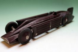 A Bakelite clockwork model of the Golden Arrow with rubber tyres. Stamped A G Ltd. Patent number