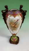 A late 19th Century Sevres style style vase with bronze caryatid side handles. Painted with a