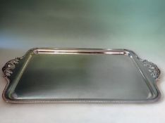 A hallmarked silver rectangular serving tray. With gadroon rim, acanthus moulded handles. Birmingham