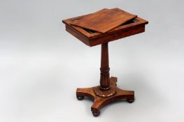 A William IV mahogany occasional table/jardiniere on carved and turned column and quatrefoil base.