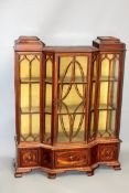 An apprentice’s mahogany breakfront miniature bookcase. Fitted with three short drawers. Glazed door