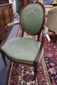 A Georgian carved beechwood neo classical design armchair. Oval back, shaped seat. Turned fluted