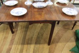 A late 18th Century mahogany drop leaf table. With square chamfered legs. 117cm wide. 140cm