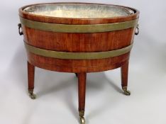 An inlaid and brass bound mahogany oval Georgian and later wine cooler on stand. Brass carrying