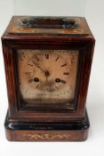 A late 19th Century French inlaid rosewood cased mantel clock with silvered dial. Brass drum head