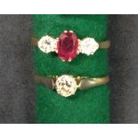 An 18ct gold diamond and ruby three stone ring.