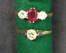 An 18ct gold diamond and ruby three stone ring.