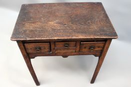 A Georgian hardwood lowboy. Three frieze drawers, chamfered straight legs. Possibly Colonial. 72cm