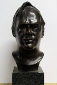 A 20th Century bronze portrait bust of a gentleman. Signed Phillip Steegman. Mounted on green marble