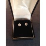 A matched pair of diamond single stud earrings. 0.50 carat each.