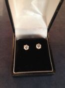 A matched pair of diamond single stud earrings. 0.50 carat each.