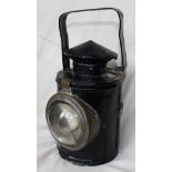 An old, single aspect Handlamp with blanking drum and bullseye lens within a brass cowl. Handle