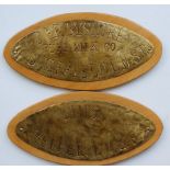 A pair of thin, oval  brass Milk Churn Plates. One is stamped 'Pure Milk Company Berbyshire