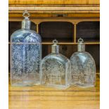 LUISE RAINER GROUP OF THREE ETCHED GLASS DECANTERS