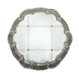 FLORIFORM WALL MIRROR A black and silver gilt mirror with multiple plates of mirrored silver glass