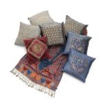 DECORATIVE INDIAN PILLOWS A group of seven decorative Indian pillows, some with beading and silvered