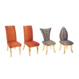 GROUP OF FOUR DINING CHAIRS Four assorted side chairs with blue or red star covered upholstery.