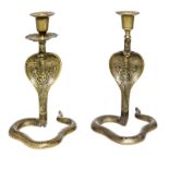 PAIR OF BRASS COBRA CANDLESTICKS With incised decoration.