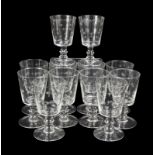 ETCHED STAR WINE GLASSES A dozen crystal wine glasses with an etched star pattern.Height, 5 1/2