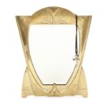 ART NOUVEAU TABLE MIRROR A brass Art Nouveau period table mirror with beveled glass, together with