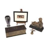 GROUP OF DECORATIVE ITEMS A statue of a reclining boy, together with an Egyptian style print on a