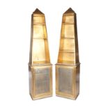 PAIR OF GILTWOOD ETAGERES A pair of modern lighted obelisk form gilt painted etageres on cabinets.