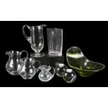 GROUP OF HOLLOWWARE A group of assorted pitchers together with a vase, a pair of candle holders.Size