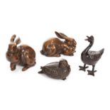 FOUR METAL ANIMAL FIGURINES Including two rabbits and two ducks. Some marked "Made in Japan."
