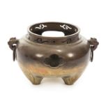 ASIAN BRONZE JARDINIERE With dragon-form handles and tripod feet.Height, 8 inches, Diameter, 8