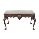 CHIPPENDALE STYLE LIBRARY TABLE A carved Chippendale style table with a pull-out drawer featuring