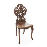 ANTIQUE SWISS CARVED CHAIR An antique chair with highly detailed carved bears on the back and a