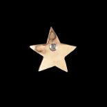 RINGO STARR GOLD STAR PIN A 14k gold star form pin with rose cut diamond accent, signed with a
