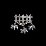 RINGO STARR SILVER PIG PIN A sterling silver picket fence bar pin with three silver pigs suspended