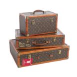 GROUP OF LUGGAGE Three graduated cases of luggage with leather LV monogram decoration. These