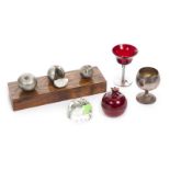 GROUP OF ITEMS INCLUDING APPLES A wood and metal sculpture, a candle, an acrylic paperweight, and