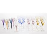 ASSORTED COLORED WINE GLASSES A group of 17 wine stems in three colors, together with six smaller