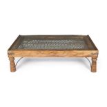 MOORISH TEAK COFFEE TABLE A coffee table made from an antique reclaimed door, with a carved wooden