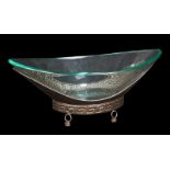 LARGE GLASS FRUIT BOWL A large oval glass fruit bowl with a hammered bronze base.9 1/2 by 24 by 14