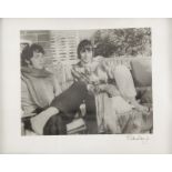 PATTIE BOYD PHOTOGRAPH A framed, candid, black and white photograph of Starr and Paul McCartney